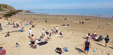 London, England, Folkestone, Kent: June 1st 2019:Tourists on Sunny Sands Beach Enjoying the ...