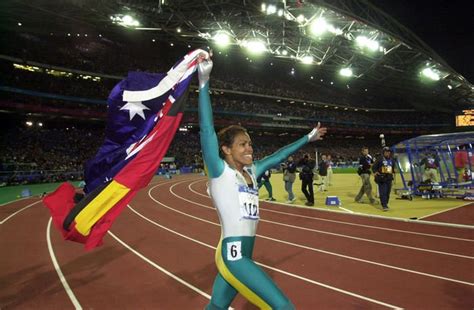 Cathy Freeman again ran a lap of honour carrying the Australian and ...