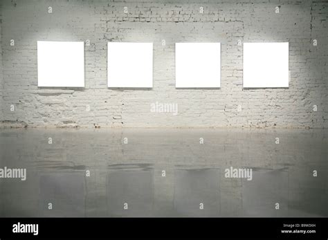 frames on white brick wall Stock Photo - Alamy