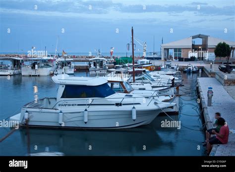 Two Boys Fishing, Cala Bona, Mallorca, Spain Stock Photo - Alamy