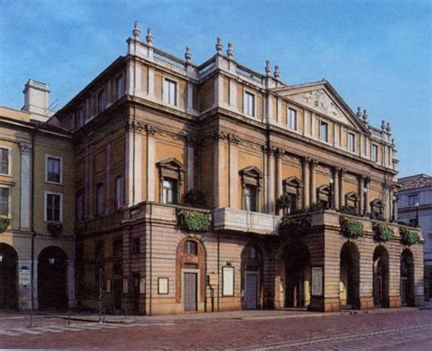 an old building with many windows and balconies