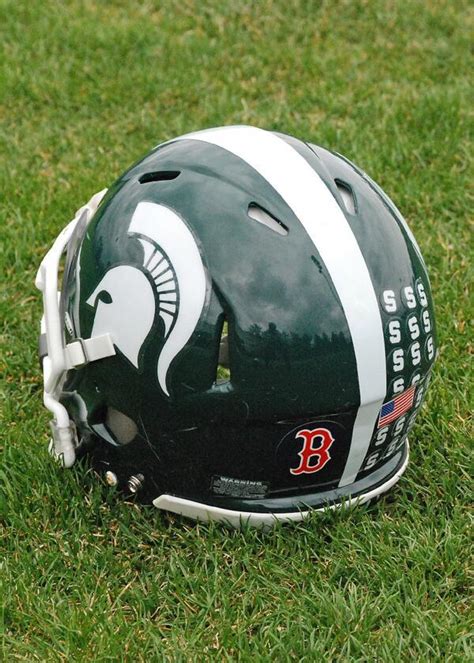 Michigan State's players wore special helmet decals for spring game.