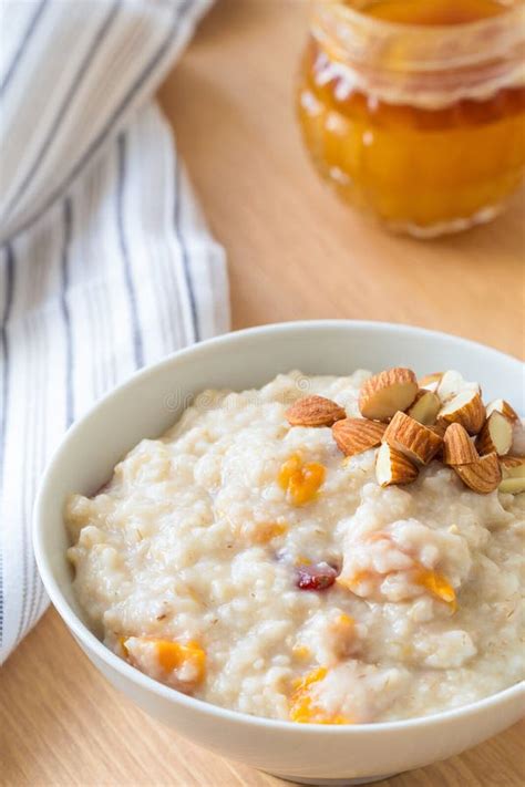 Porridge Oats with Almonds, Dried Fruits and Honey Stock Photo - Image ...