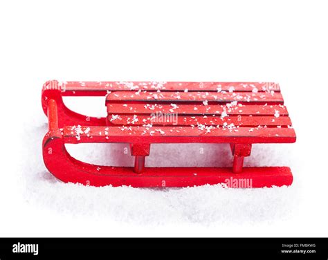 Red sled with snow isolated on white background Stock Photo - Alamy