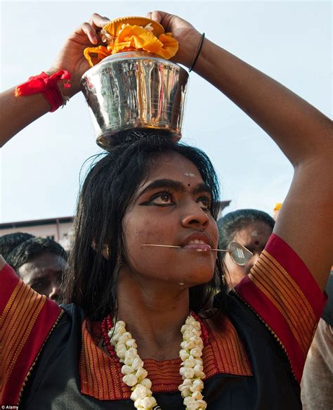 Thaipusam festival sees devout Hindus pierce cheeks with spears | Daily ...