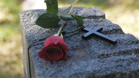 Red Rose and Cross on a Headstone · Free Stock Video