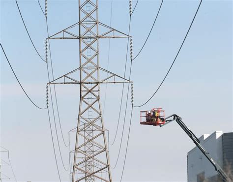 Two workers stranded near high tension power lines in west Tracy ...