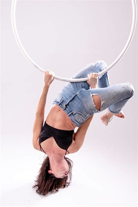 Premium Photo | A female aerial hoop gymnast performing exercises on an ...