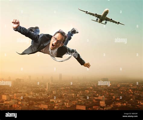 business man flying from passenger plane flying over sky scraper Stock Photo - Alamy