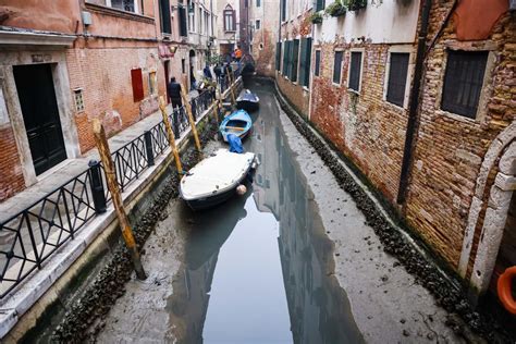 Venice canals run dry as lingering weather system impacts tide cycles