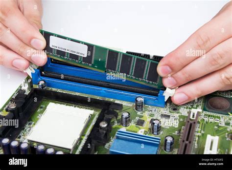 Man installing memory. PC motherboard RAM upgrade Stock Photo - Alamy