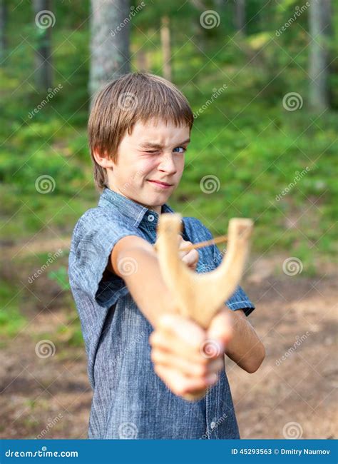 Kid with slingshot stock image. Image of activity, shooting - 45293563