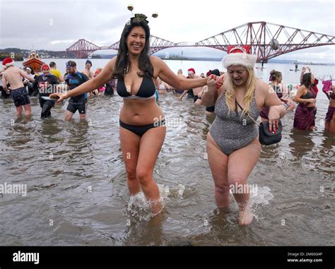 People take part in the Loony Dook New Year's Day dip in the Firth of Forth at South Queensferry ...