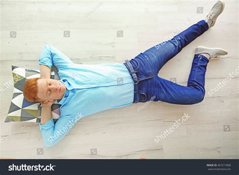 Young Man Sleeping On Floor Stock Photo 407217868 - Shutterstock