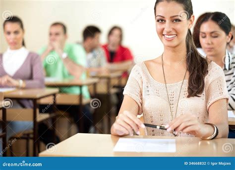 Happy student in classroom stock photo. Image of smiling - 34668832