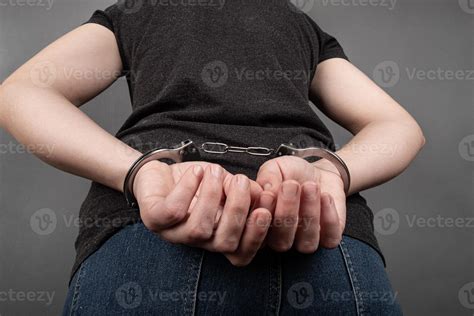 Arrested girl with handcuffs was pressed against the wall by the police. 3313780 Stock Photo at ...