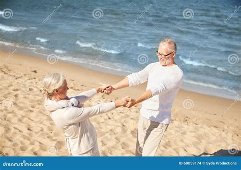 Happy Senior Couple Holding Hands on Summer Beach Stock Photo - Image ...