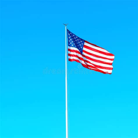 The Spirit of America: Waving Flag on a Sunny Day Stock Image - Image ...