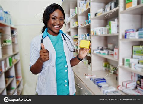 African american pharmacist working in drugstore at hospital pha Stock ...