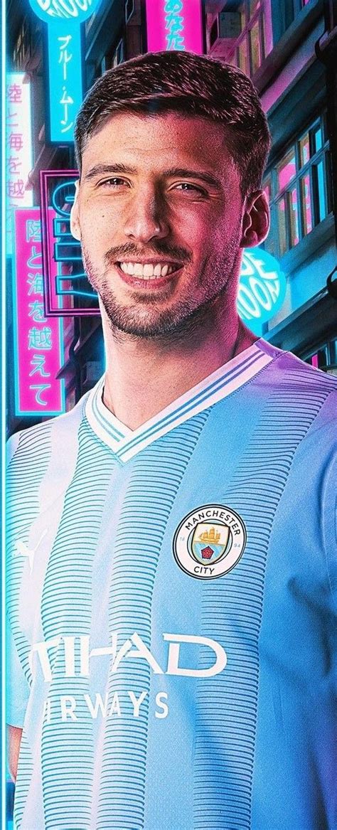 a man in a soccer uniform is smiling at the camera with neon lights ...