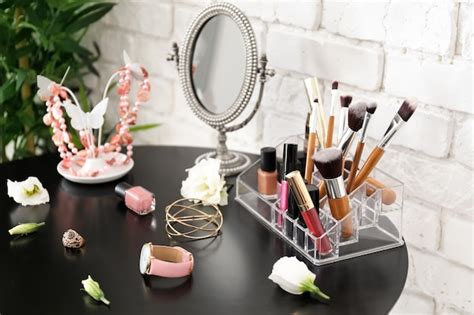 Premium Photo | Set of decorative cosmetics and beauty accessories on dressing table indoors