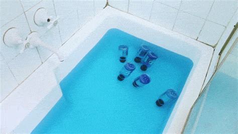 lesprisenpati:aidenmorse:Bottles of Gatorade Blue Bolt floating in a bath of Powerade Mountain ...