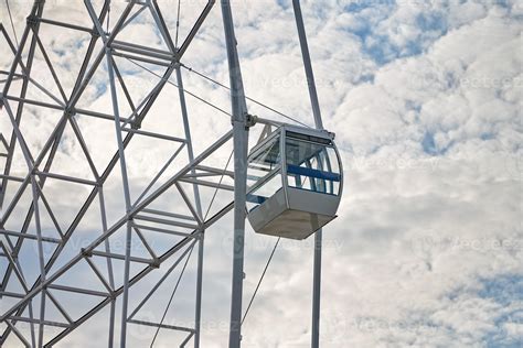 Ferris wheel cabin in amusement park close up blue sky background, Bird's Eye view attraction ...