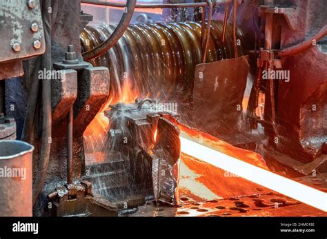 The process of rolling hot rolled steel in a rolling mill Stock Photo ...