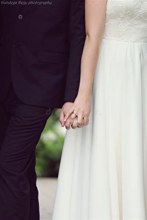 Wedding Couple Holding Hands Stock Photo - Image of ceremony, drive ...