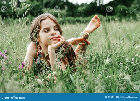 Teenage Girl with Long Hair and Bare Feet in the Grass Stock Photo - Image of fresh, patrick ...