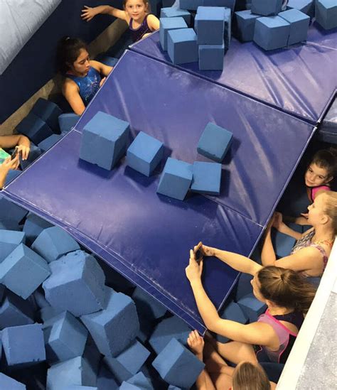 Gymnasts in training find cozy tornado shelter in center's foam pit ...