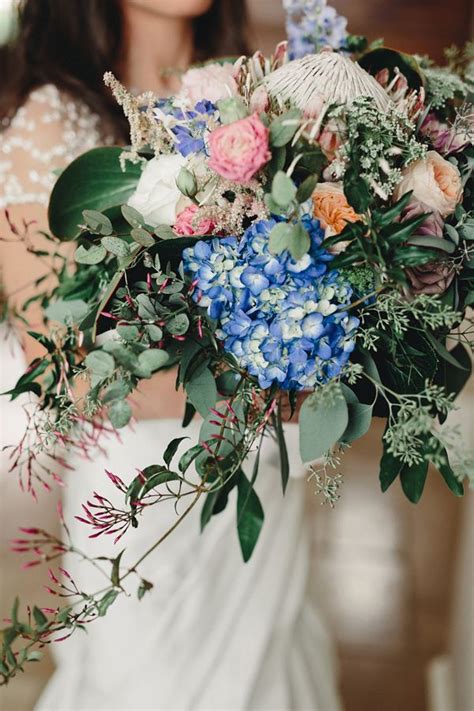 Romantic Iowa Wedding | Blue wedding flowers, Wedding bouquets, Wild wedding bouquet