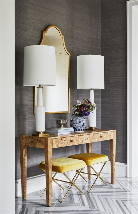 Dark gray grasscloth wallpaper + console table with matching lamps ...