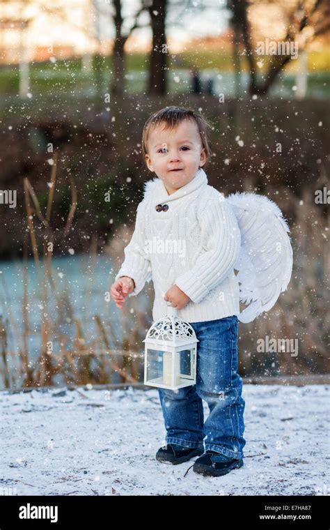 Boy with angel wings Stock Photo - Alamy