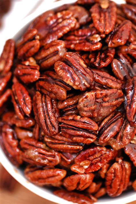 a white bowl filled with lots of pecans