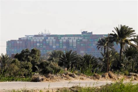 Stranded container ship at Suez Canal partially refloated | Photos | GMA News Online