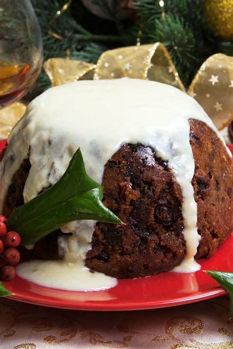 Traditional Christmas Plum Pudding with Hard Sauce Recipe with molasses, butter, milk, eggs ...