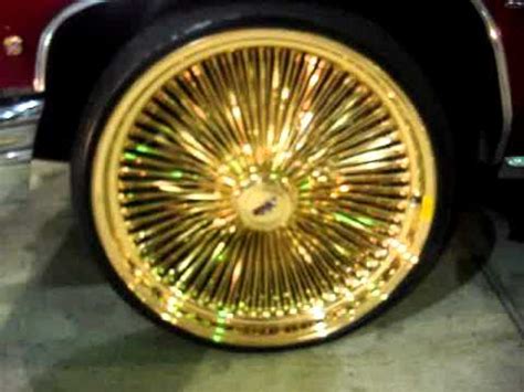 1976 CANDY APPLE RED CAILLAC ON 24" ALL GOLD DAYTONS RIMS - YouTube