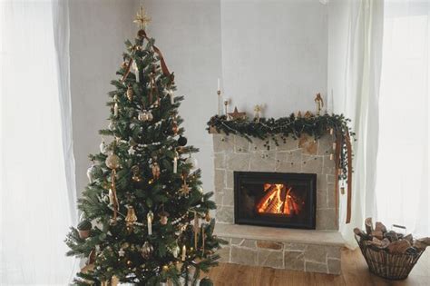 Premium Photo | Atmospheric christmas living room with stylish tree and fireplace decorated ...