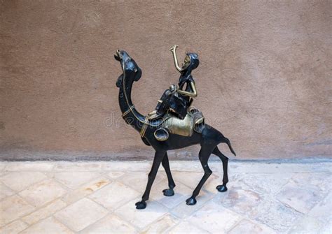 Bronze Sculpture of a Man Riding a Dromedary Camel in Marrakesh, Morocco. Stock Image - Image of ...