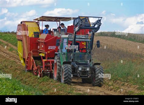 Potato Harvester Tractor harvesting murphy tater field rural scene ...