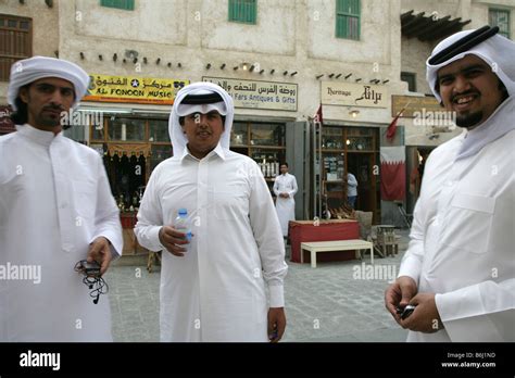 Qatari men in traditional attire at the Souq Waqif market in Doha, Qatar Stock Photo - Alamy