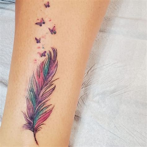 Vibrant Watercolor Feather Tattoo