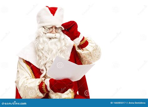 Santa Claus in Glasses Reading a Wish Letter with a List of Gifts ...