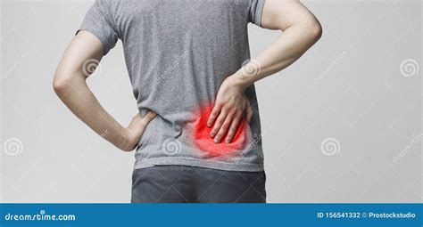 Young Man Holding His Painful Inflamed Loin Stock Photo - Image of ...