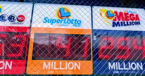 Lotto signs installed on the wall of a gas station where the winning ...