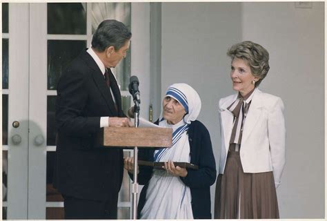 Photograph of The Reagans presenting Mother Teresa with the Medal of ...