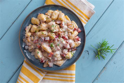 Gnocchi with speck and walnuts - Italian recipes by GialloZafferano