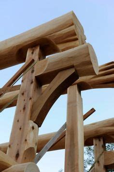 Combining square timber framing and round log beams for a fresh ...