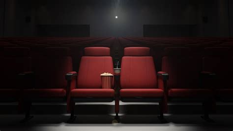 Premium Photo | Movie theater seat with popcorn and drink 3d rendering